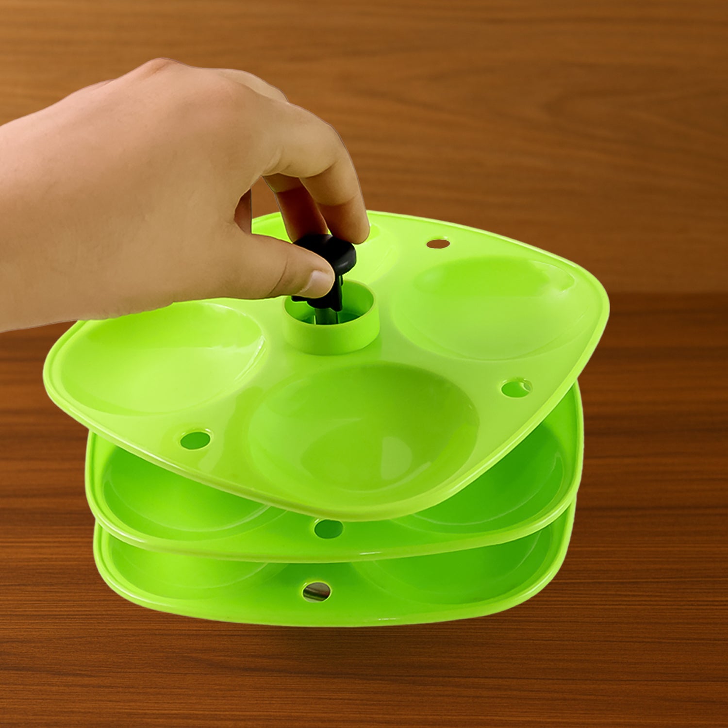 Wukusy 3-layer Idli stand used in household kitchens for holding and serving idlis, with stacked aluminum compartments.