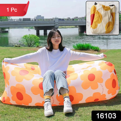 Wukusy portable inflatable air lounger sofa set up outdoors on grass, ideal for beach, garden, and travel relaxation.
