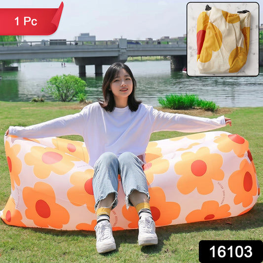 Wukusy portable inflatable air lounger sofa set up outdoors on grass, ideal for beach, garden, and travel relaxation.