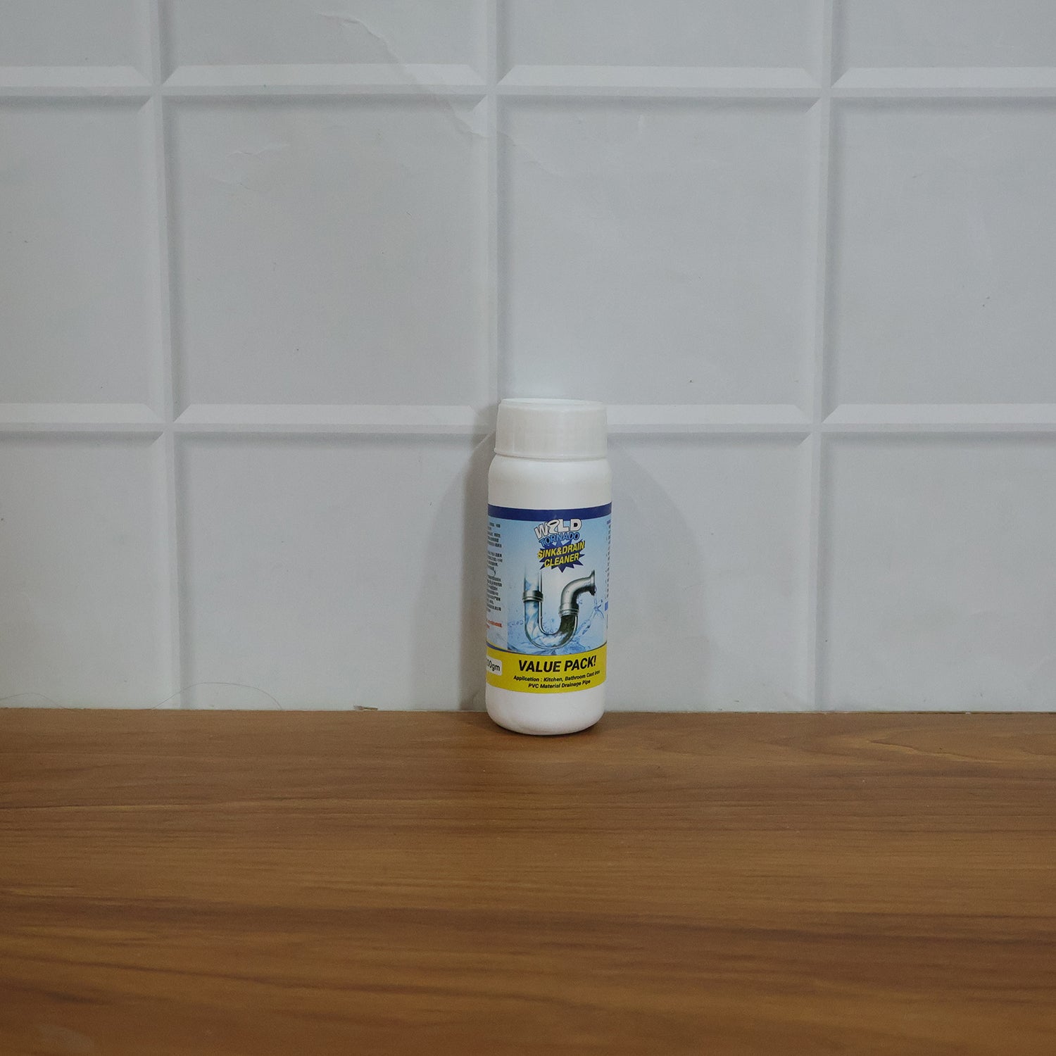 Wukusy sink and drain cleaner powder in a 200g package, showing the powder's texture and cleaning effectiveness