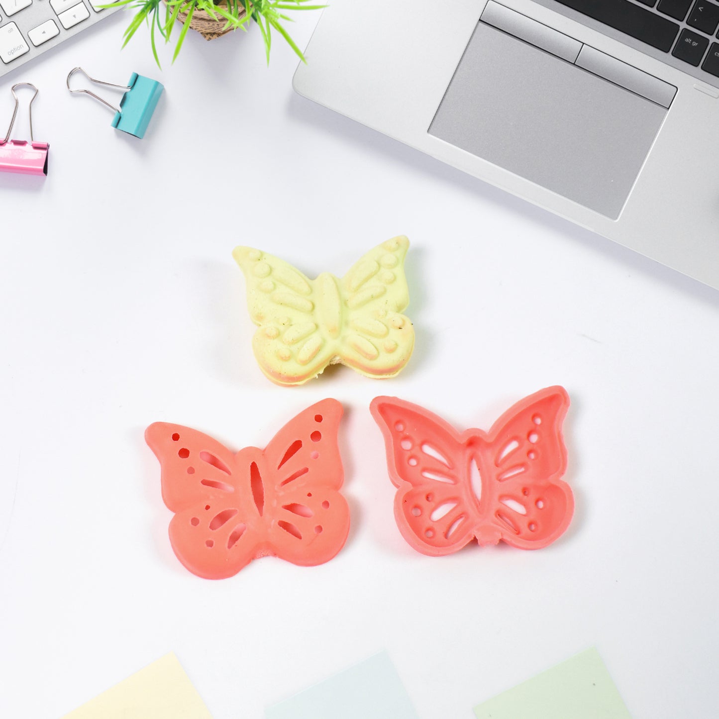 Colorful butterfly-shaped rubber eraser by Wukusy, perfect for office or school use with mixed vibrant colors.