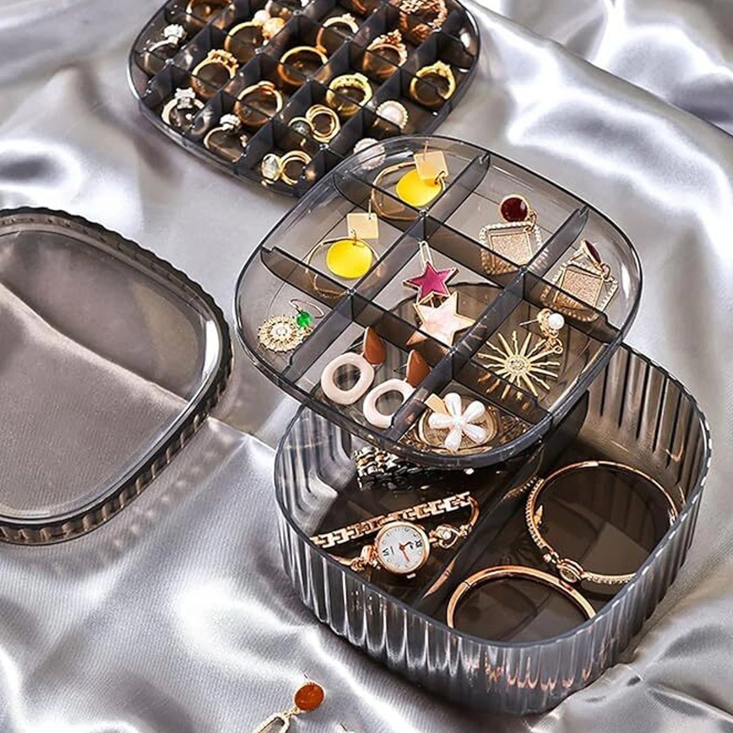 Wukusy plastic multi-compartment jewelry organizer box with stackable design, ideal for storing rings and small jewelry pieces.