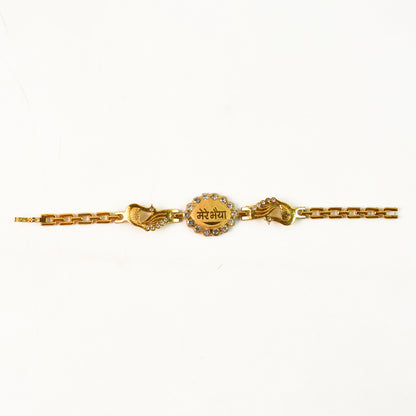 Wukusy bracelet with stone border and dual peacock chain ends, traditional Rakhi for festive occasions.
