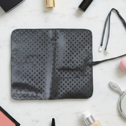 Wukusy premium foldable makeup brush organizer bag with multiple compartments for storing brushes and cosmetics.