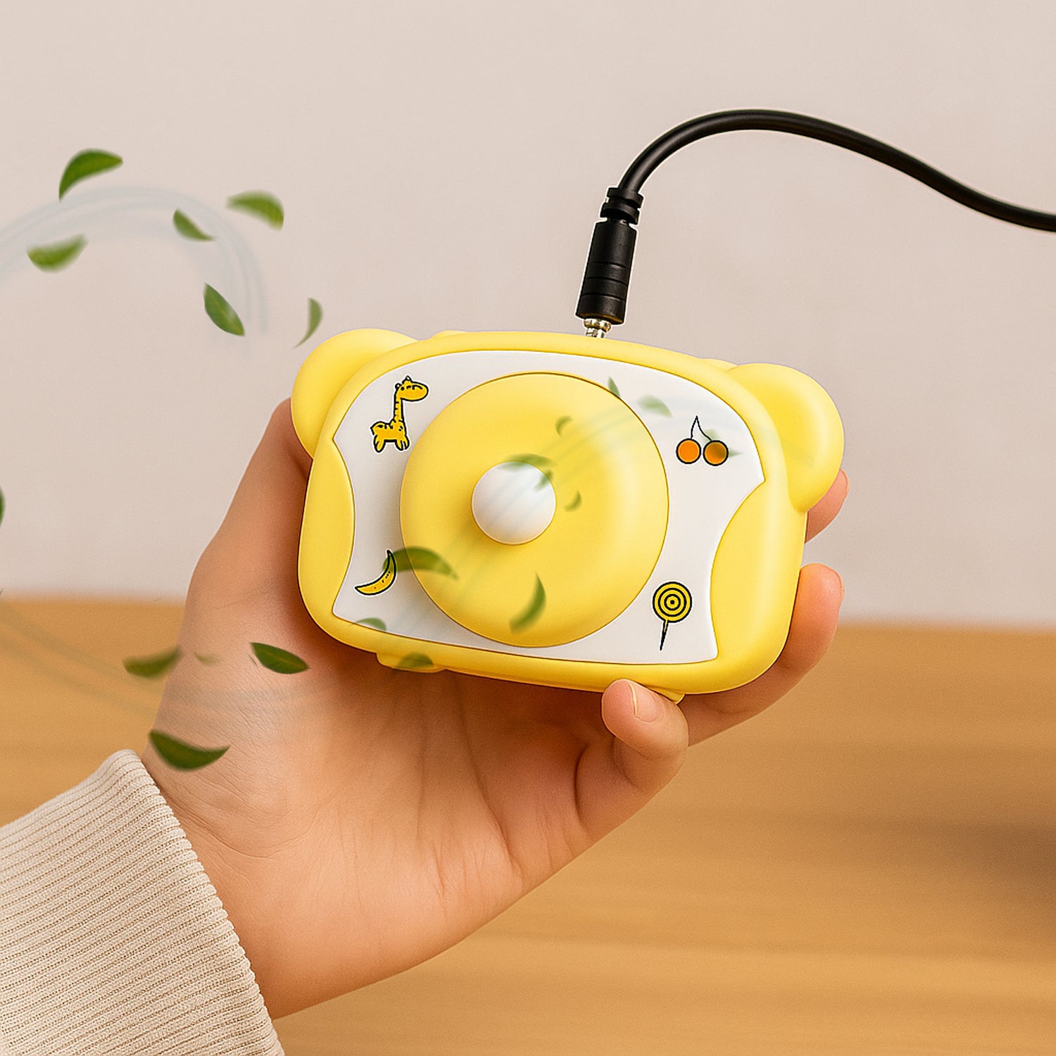 Cute bear-shaped Wukusy mini rechargeable fan designed for office use, showing the fan with bear design and compact size.