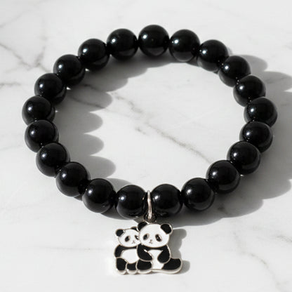 Black beaded stretch bracelet by Wukusy with a cute panda charm, featuring elastic design for comfortable wear.