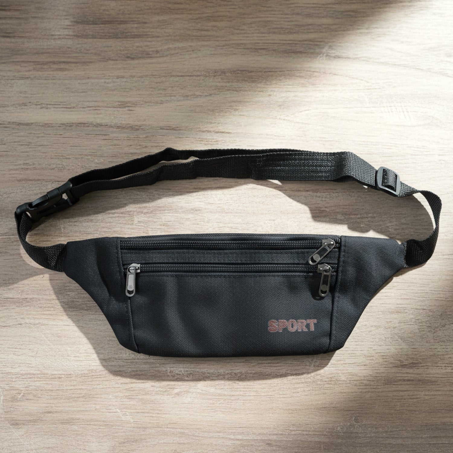 Black sports waist bag by Wukusy with adjustable strap and multiple compartments for convenient carrying during activities.