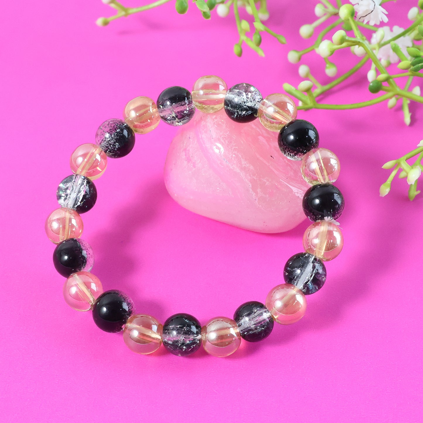 Elegant dual-tone crystal beaded stretch bracelet by Wukusy with shimmering beads on a flexible elastic band.