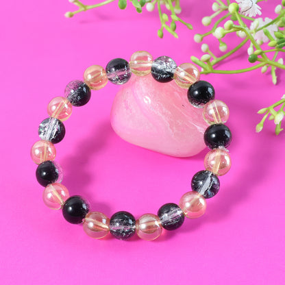 Elegant dual-tone crystal beaded stretch bracelet by Wukusy with shimmering beads on a flexible elastic band.