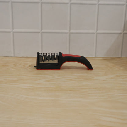Wukusy 4-stage manual knife sharpener with non-slip base, featuring multiple sharpening slots and ergonomic handle for kitchen use.
