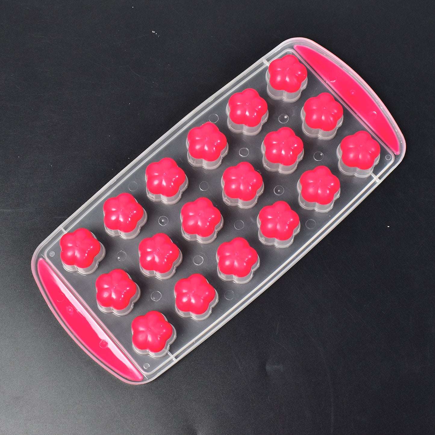 Wukusy 7165 flower-shaped ice mold with 18 cavities for making small flower and sphere ice cubes in a silicone tray.