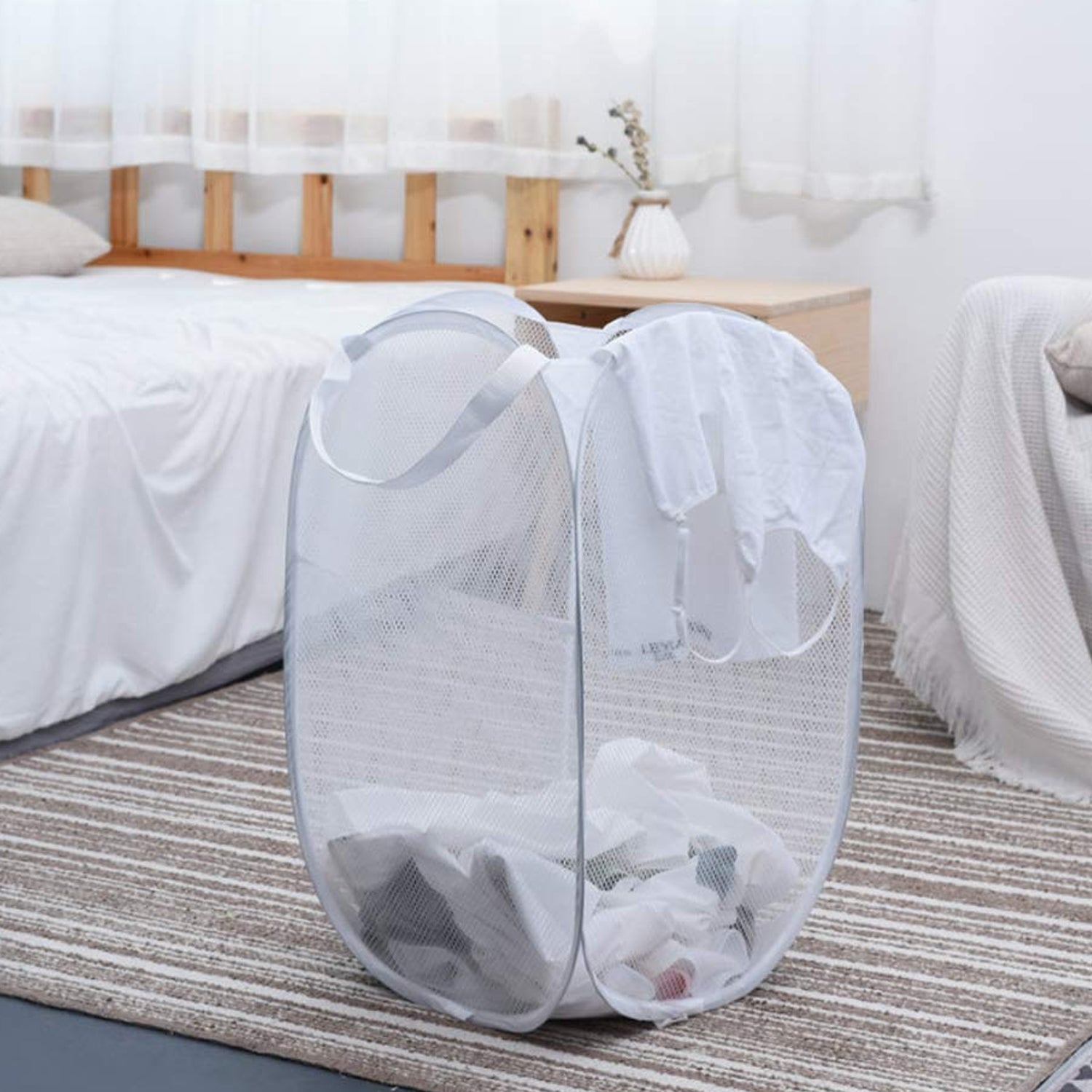 Wukusy foldable laundry basket with fabric mesh design, 33x33x54cm, lightweight clothes hamper for easy storage and transport.