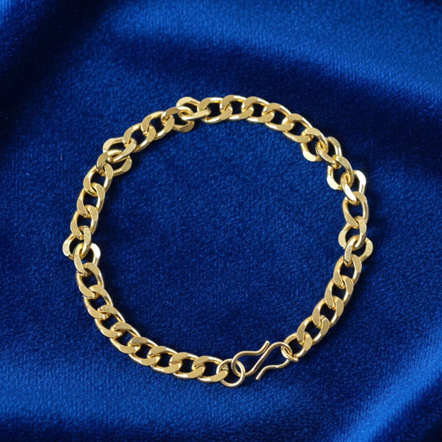 Gold finish chain link bracelet by Wukusy, unisex design, showing close-up of the classic linked jewelry piece.