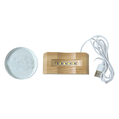 Wukusy 3D crystal LED table lamp with intricate geometric design and glowing illumination on a sleek wooden table.
