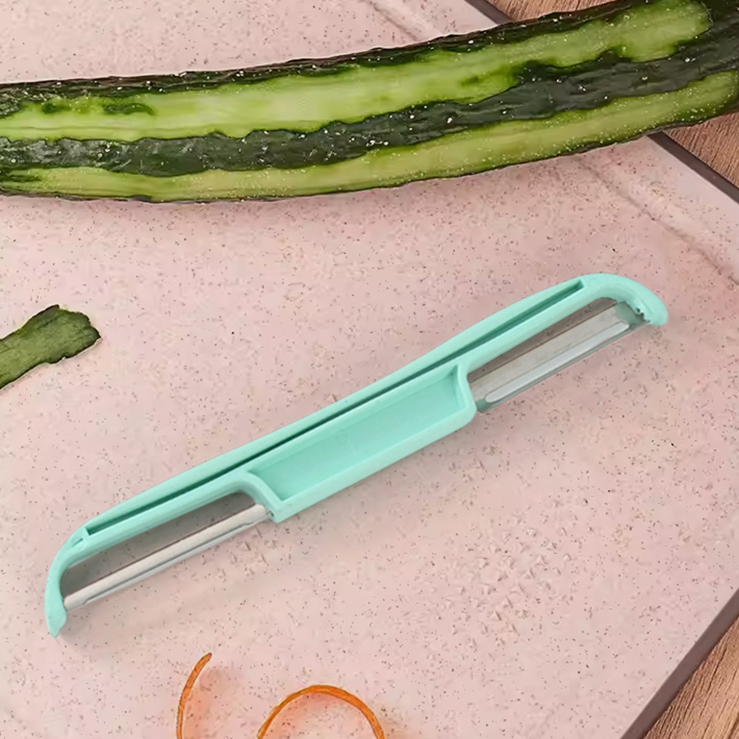 Stainless steel double side potato peeler by Wukusy, showing the peeler with ergonomic handle and sharp blades for efficient peeling.