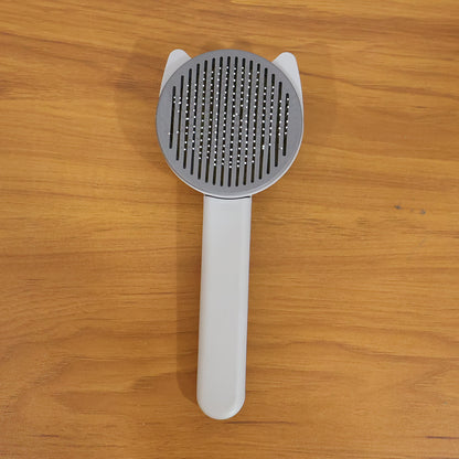 Wukusy soft pet hair removal needle comb with fine metal teeth for grooming cats and dogs, removing loose fur and tangles.