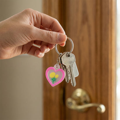 Set of 10 Wukusy heart and flower design bag charm keychains with cute, colorful accessories for bags and keys.