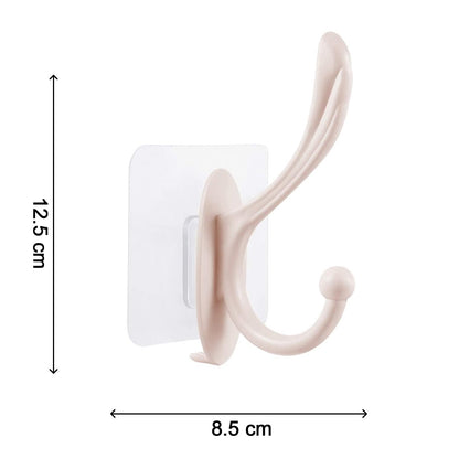 Wukusy self-adhesive plastic wall hook mounted on a wall, ideal for home organization and hanging light items.