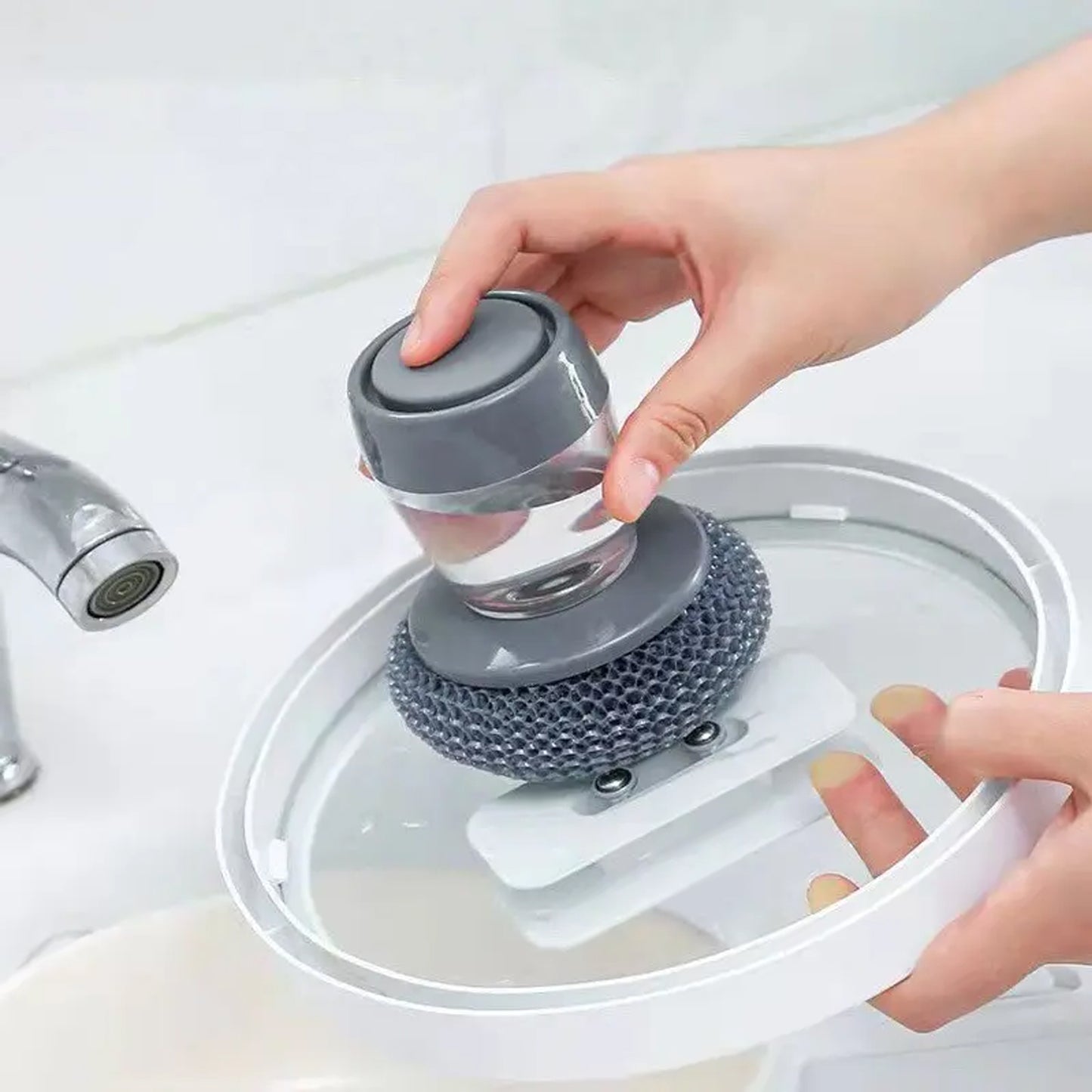 Wukusy 4921 soap dispensing palm dish brush with liquid dish soap and cleaning dispenser for kitchen utensils and pots.