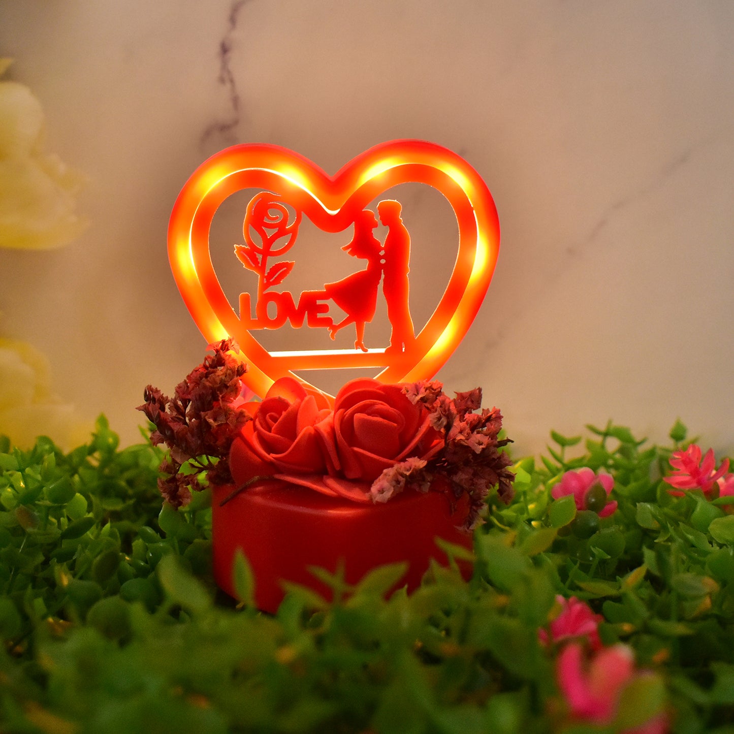 Heart-shaped love couple decorative showpiece on rose base, Wukusy home decor piece with romantic design and intricate details.