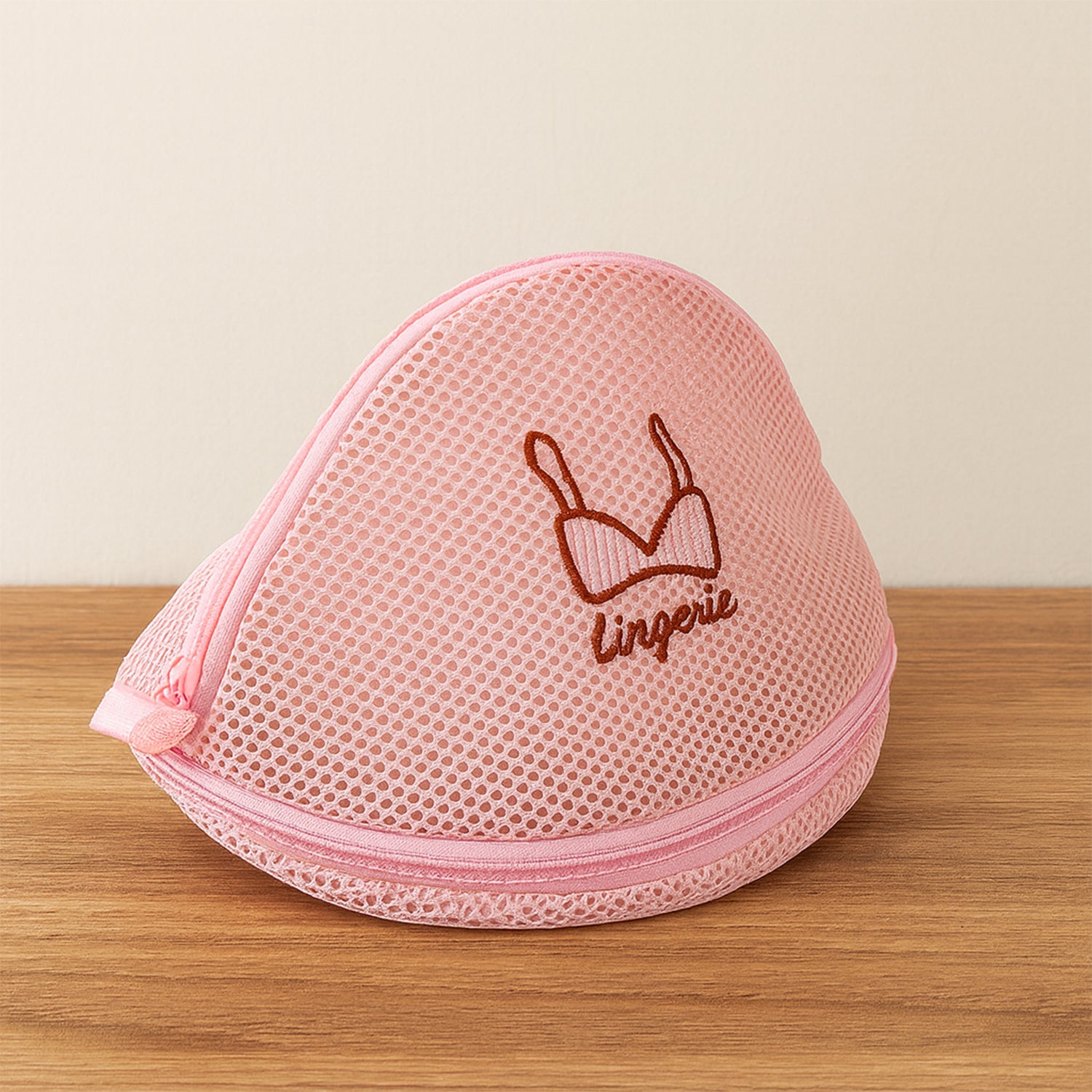 Wukusy dome-shaped lingerie wash bag made of protective mesh for laundry, designed to safeguard delicate lingerie during washing.