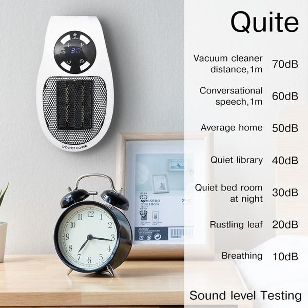 Wukusy 6033 portable electric mini fan heater on a desk, compact household home decor for warmth and comfort.