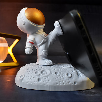 Wukusy astronaut-themed 3D mobile holder and phone stand with planet design, ideal for creative mobile accessories.