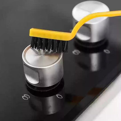 Wukusy Mini Wire Brush with nylon bristles, compact cleaning tool for home and kitchen surfaces, close-up view of the brush.