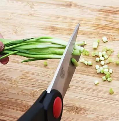 Wukusy 5-piece kitchen knife set with wooden block, including scissors and black handles, displayed on a kitchen countertop.