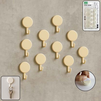 Set of 10 Wukusy self-adhesive round wall hooks mounted on a wall for home organization and hanging items.