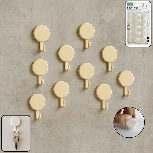 Set of 10 Wukusy self-adhesive round wall hooks mounted on a wall for home organization and hanging items.