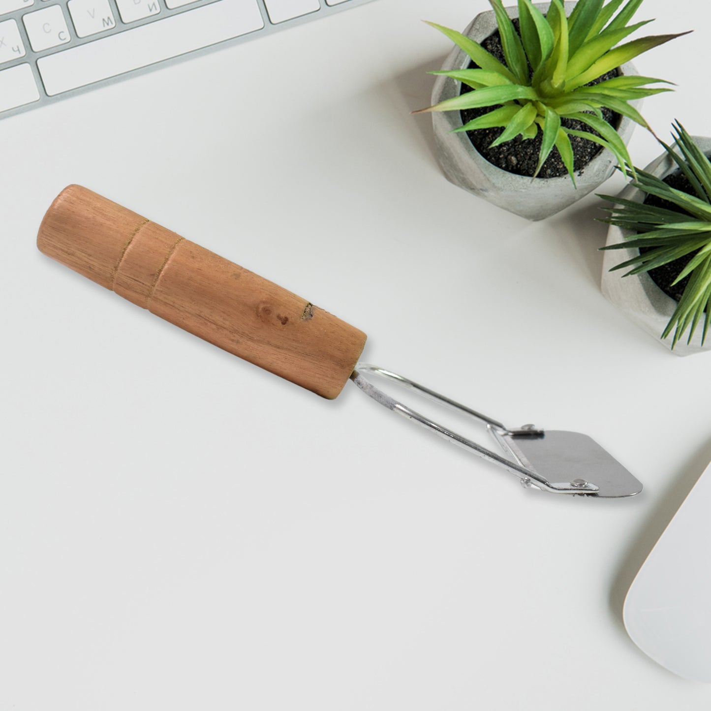 Wukusy wooden handle metal vegetable cutter peeler and slicer with ergonomic wooden grip and stainless steel blades.