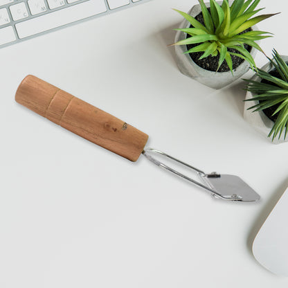 Wukusy wooden handle metal vegetable cutter peeler and slicer with ergonomic wooden grip and stainless steel blades.