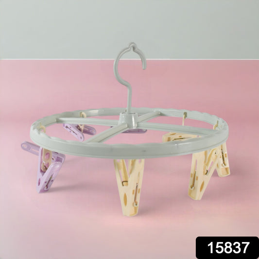 Wukusy clothespin rack for laundry drying, with multiple metal bars for hanging clothes and clothespins.