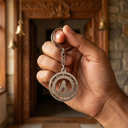 Wukusy Premium Metal Round Mahakal Keychain featuring intricate Mahakal design on a shiny metal surface.