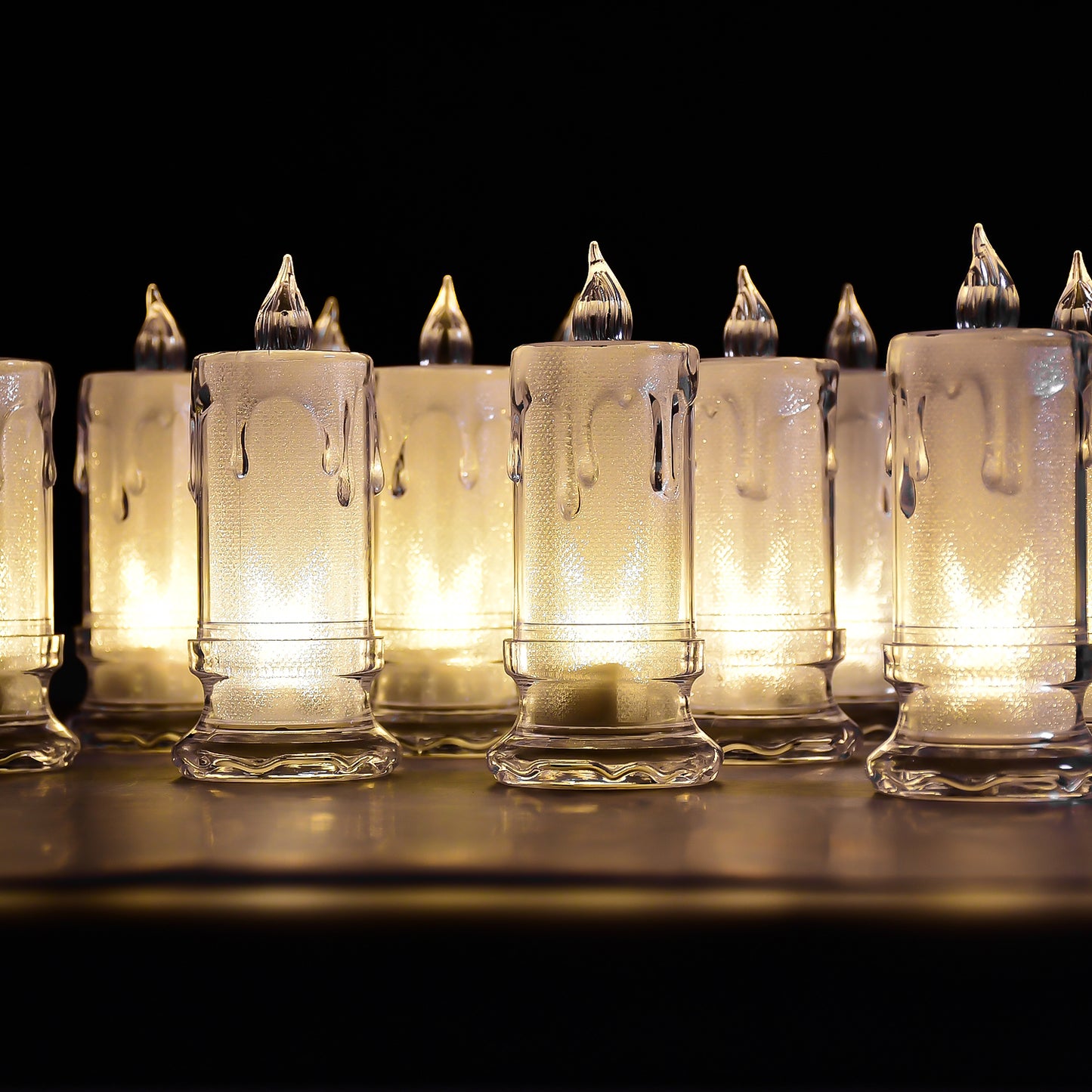 Set of 12 Wukusy flameless melted design candles for home decor, featuring large, realistic-looking LED candles in a decorative arrangement.