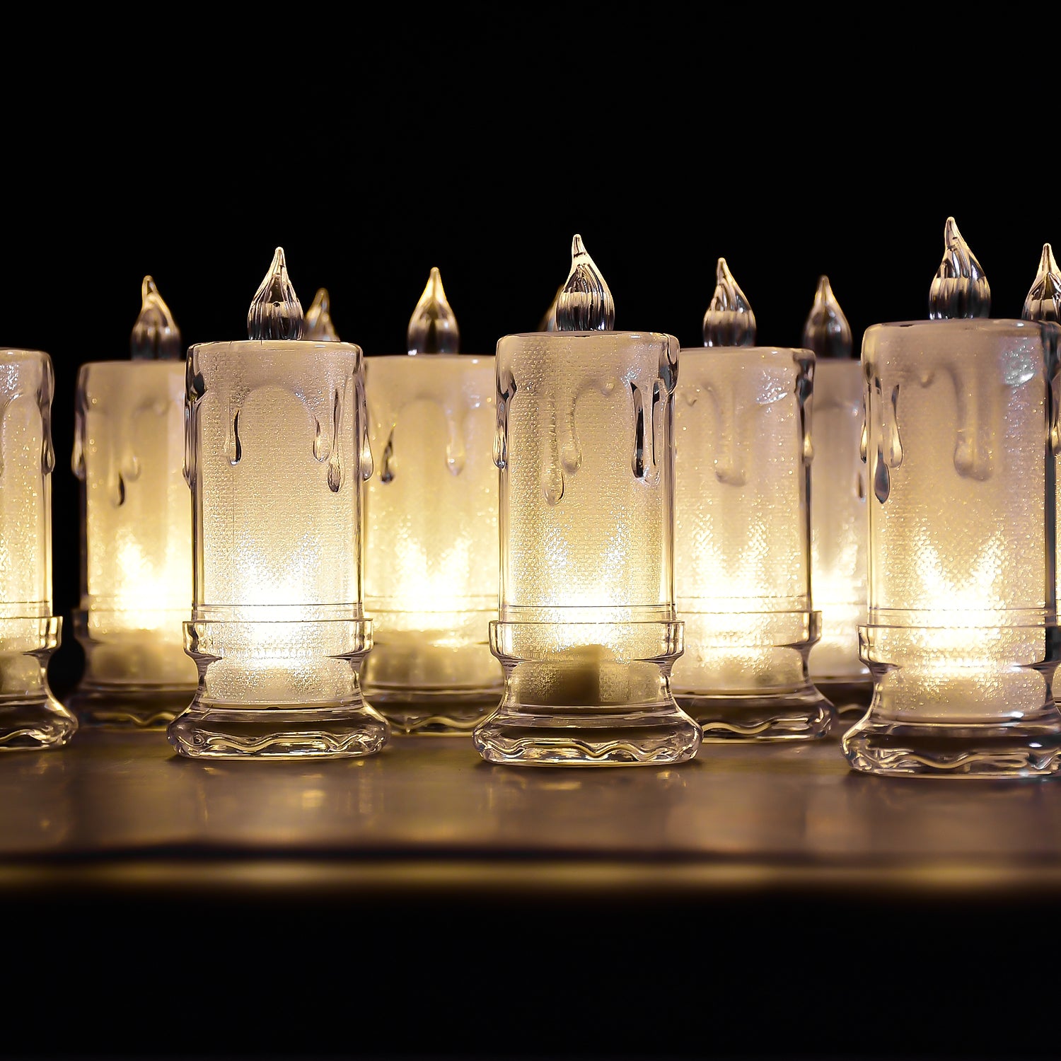 Set of 12 Wukusy flameless melted design candles for home decor, featuring large, realistic-looking LED candles in a decorative arrangement.