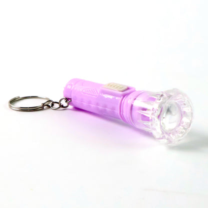 Wukusy mini LED flashlight keychain toy in mix colors, compact torch with bright light, ideal for keychains and portable use.
