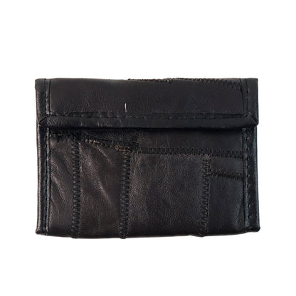Wukusy premium genuine leather bi-fold travel wallet opened to show card slots and cash compartment.