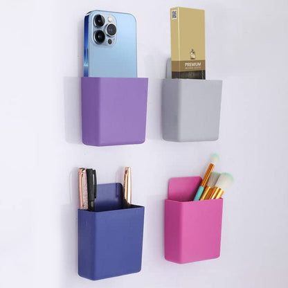 Set of four Wukusy multipurpose plastic wall-mounted remote and mobile holder stands, compact and easy to install.