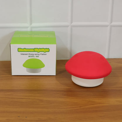 Wukusy mushroom-shaped LED night light in mixed colors, illuminated, resting on a surface with a cozy, soft glow.