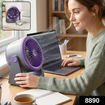 Wukusy personal desktop air circulation fan, portable USB desk fan on a workspace, compact and lightweight for personal cooling.