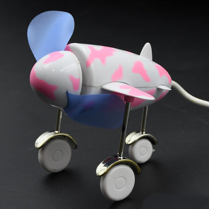 Wukusy 7721 plane-shaped USB fan with unique design, energy-saving portable fan for laptops, computers, and desktops.