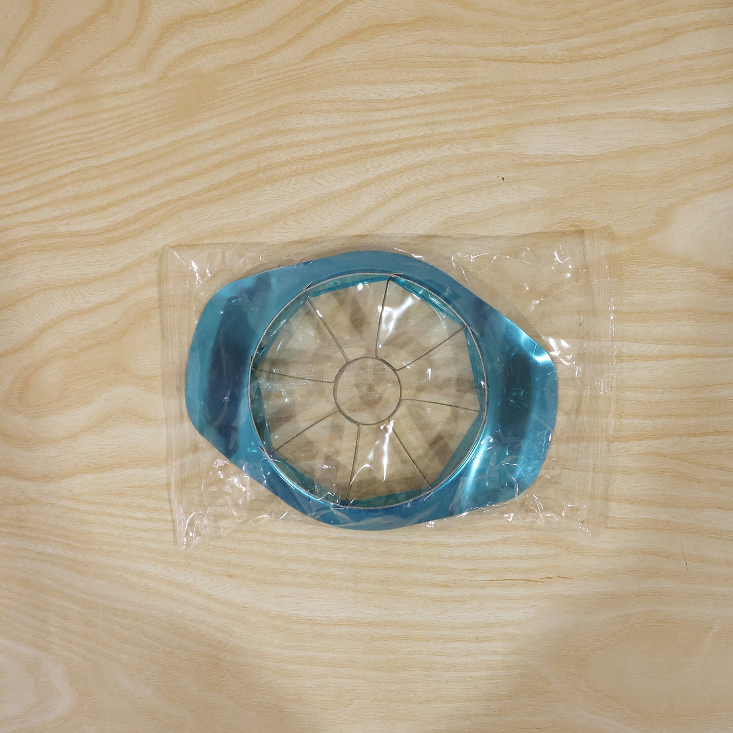 Wukusy stainless steel apple shape fruit cutter and corer for kitchen, showing the apple-shaped slicer with sharp blades.