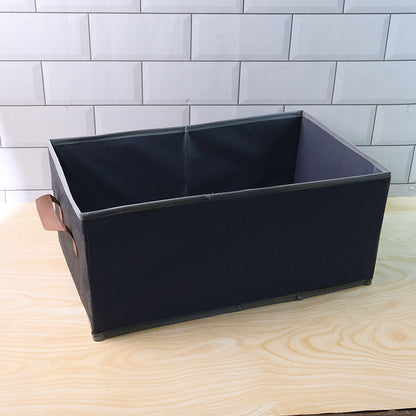 Foldable rectangular Wukusy travel storage box with handle, 46x28 cm, shown in a compact, foldable state with a sturdy handle.