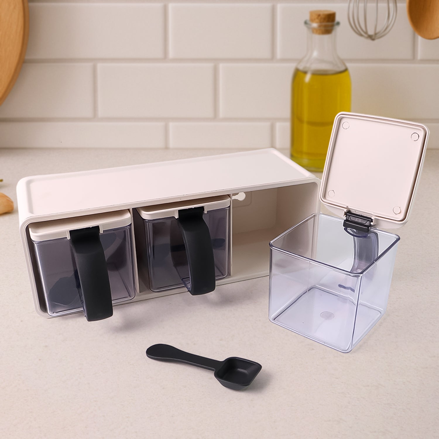 Wukusy Grinss modular spice storage box set with three clear plastic containers and black lids for organized kitchen spice storage.