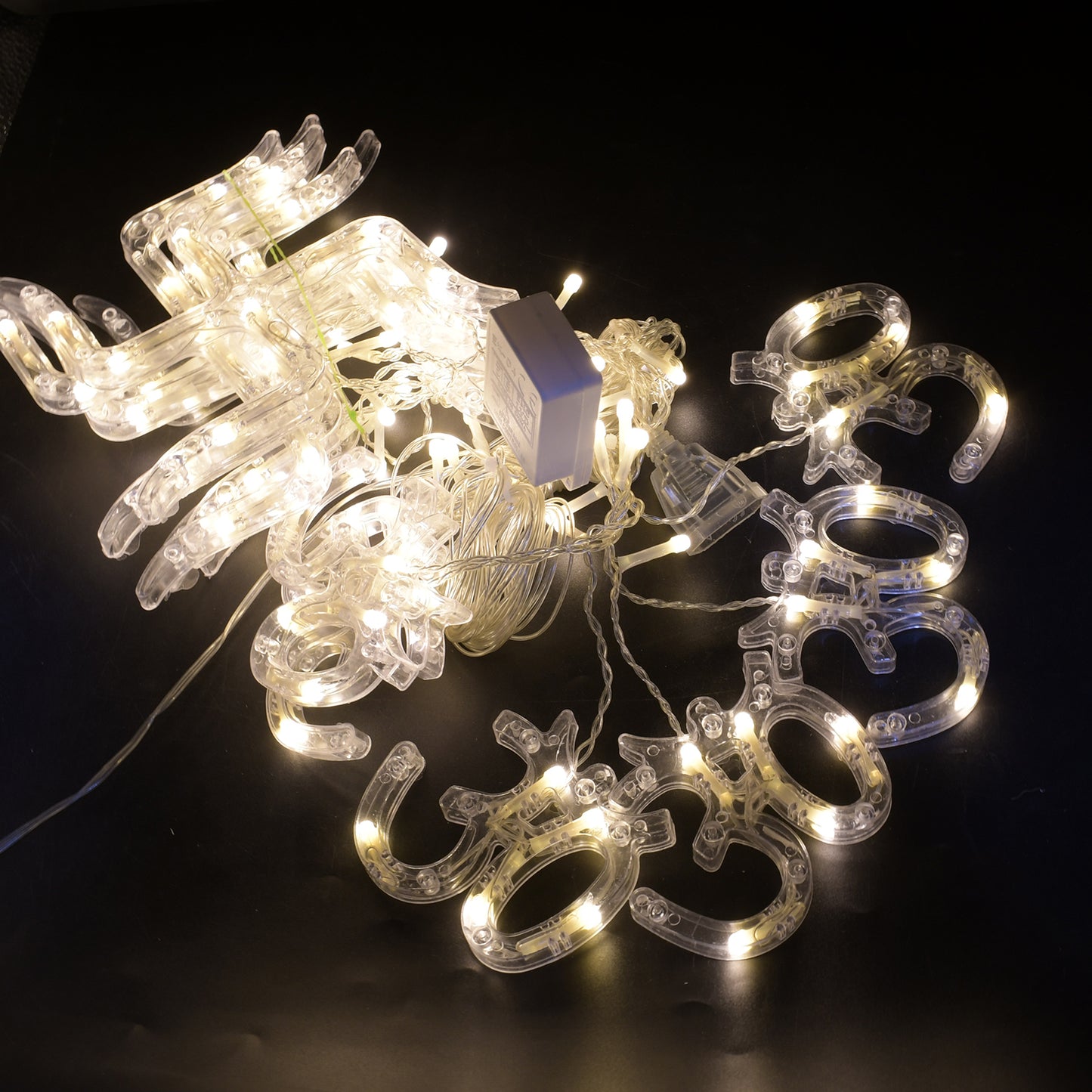 Wukusy 8320 Swastik Om decorative string lights with 12 hanging props, 138 LED Diwali home decor lights for bedroom or balcony.