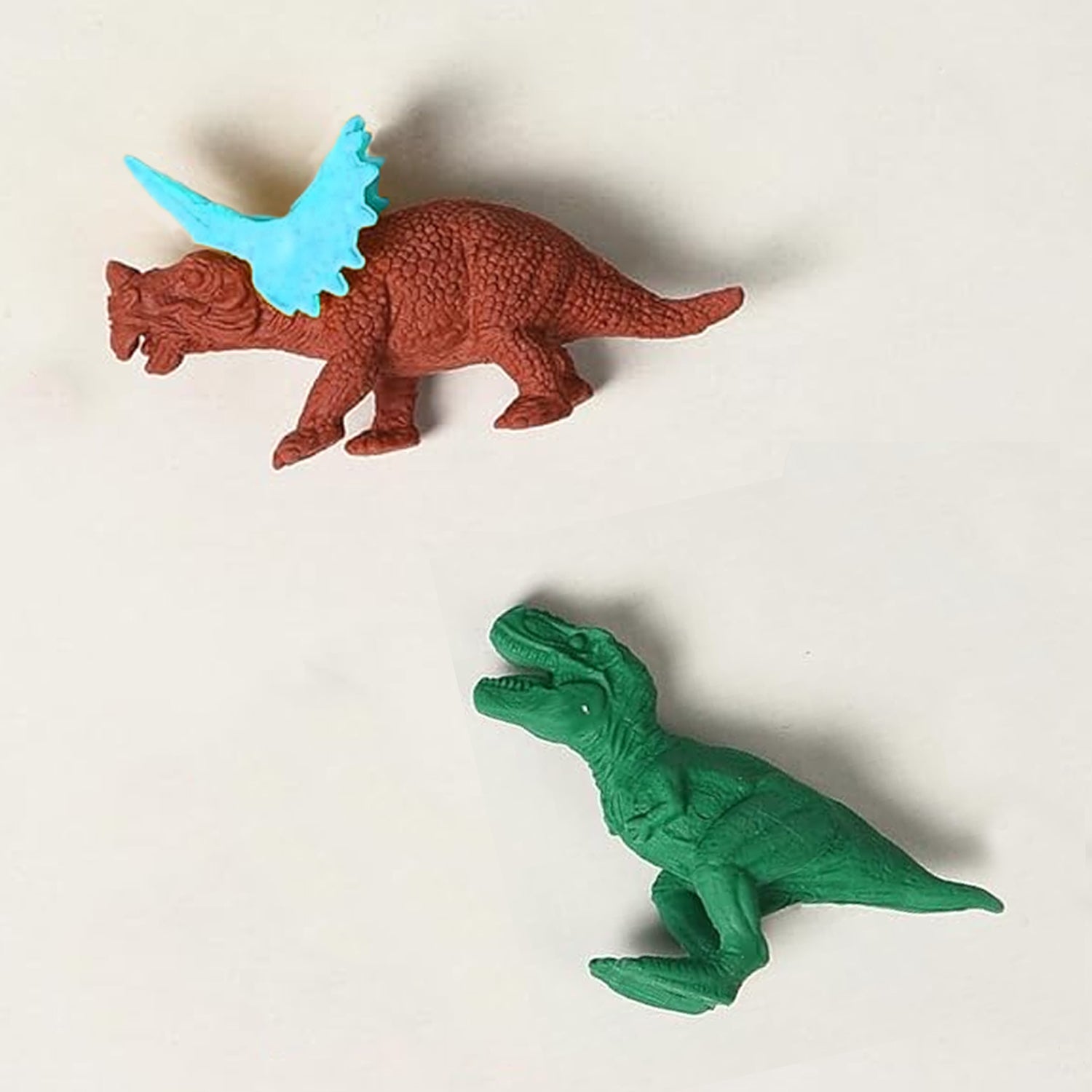 Set of 5 Wukusy dinosaur-shaped erasers in egg and puzzle designs, mini desk toys perfect for students and classroom rewards.