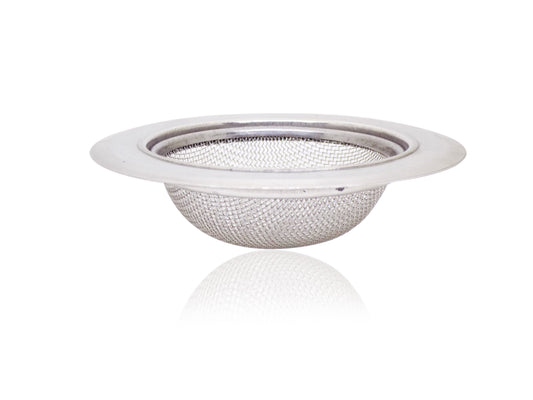 Wukusy 0791 medium stainless steel sink drain strainer in a kitchen sink, featuring a mesh design to catch debris.