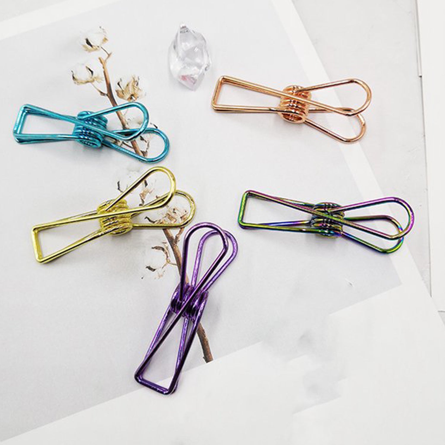 Sturdy stainless steel Wukusy clothes hanging clips for laundry and home organization, showing multiple clips attached to a clothesline.